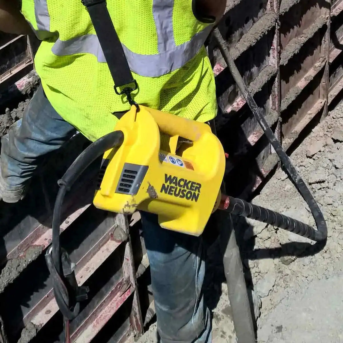 Wacker Neuson M1500 concrete vibrator in use on form