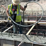 Wacker Neuson M1500 concrete vibrator in use on wall form