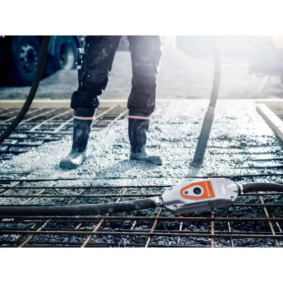 Husqvarna smart concrete vibrators in use on concrete slab