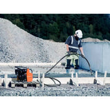 Husqvarna AMG 3200 concrete vibrator in use on slab