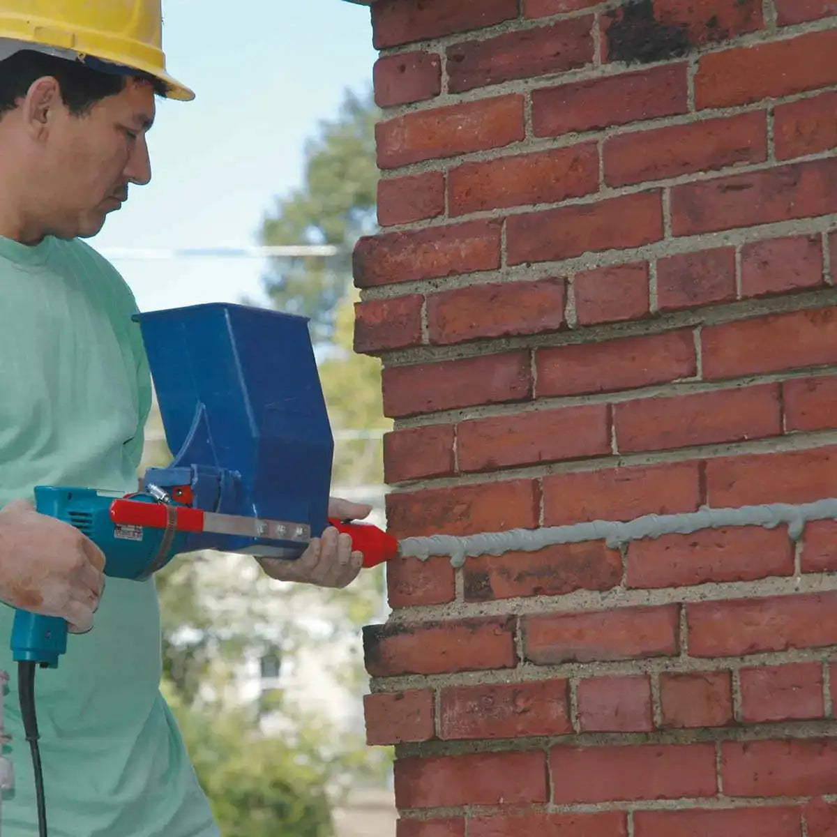 Applying Mortar with Quikpoint Gun and Drill