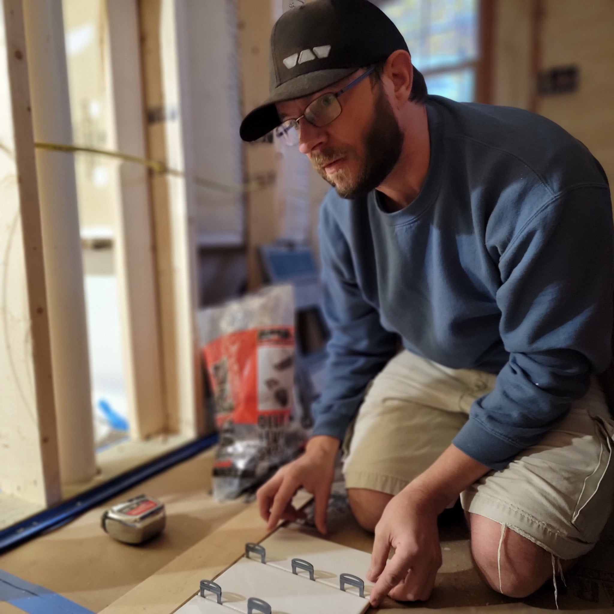 person setting tile