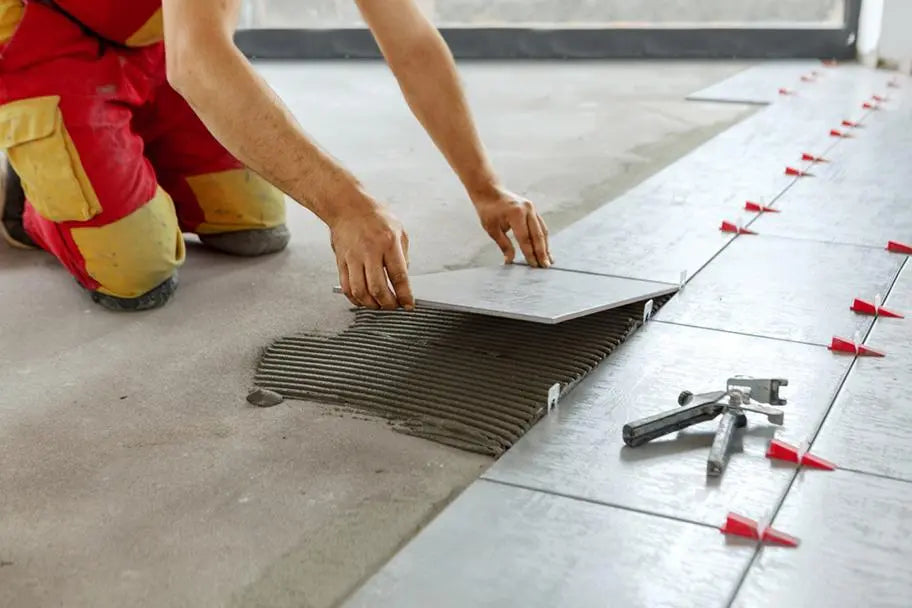 tiler placing tile