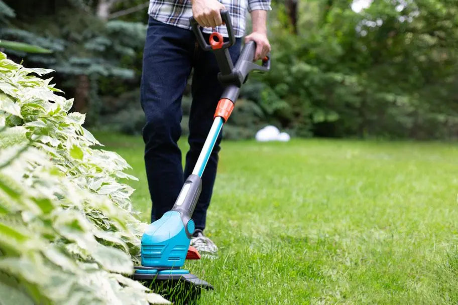 using edging tool in a home garden